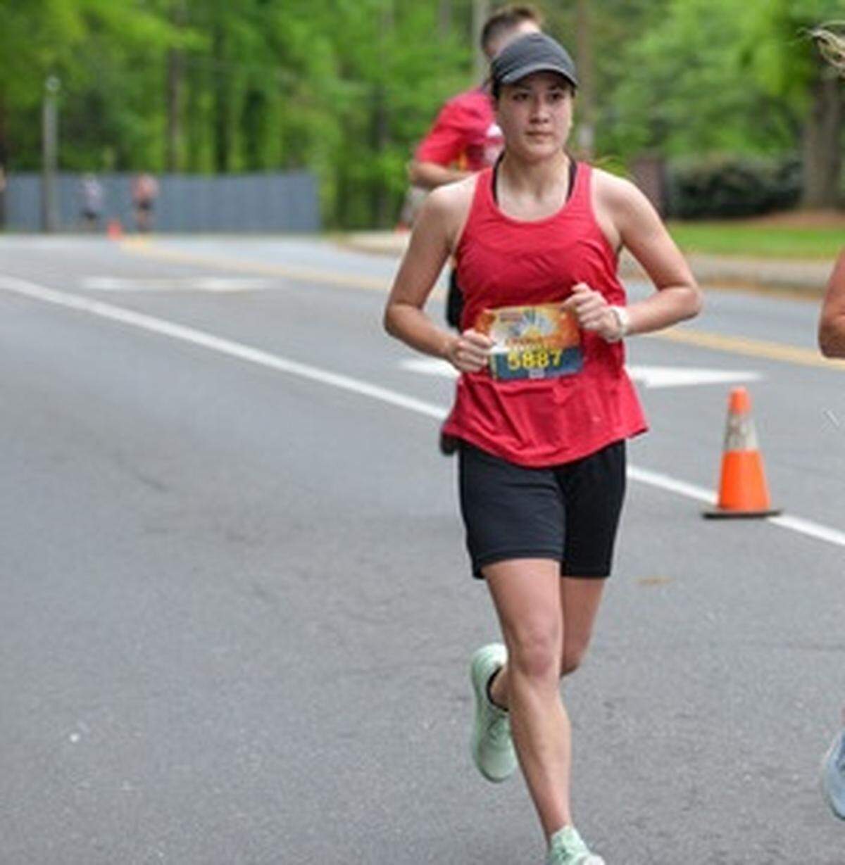 Remi Okamoto running in her first half marathon last April in Charlotte.