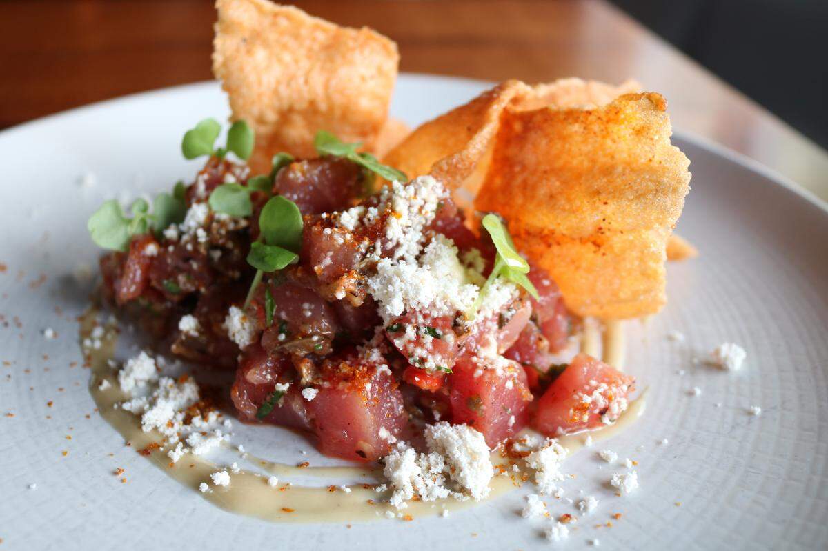 New on the menu at WP Kitchen + Bar is Tuna Tartare with caponata, pine nut puree and tomato chips.