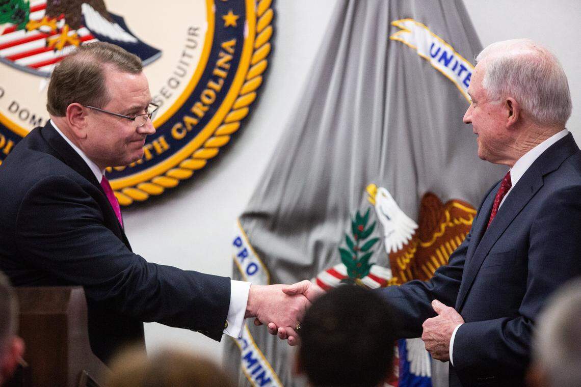 U.S. Attorney for the Eastern District of North Carolina, Robert J. Higdon Jr, left, shakes hands U.S. Attorney General Jeff Sessions, before Sessions spoke about the Trump administration’s plan to combat the nation’s opioid crisis Tuesday, April 17, 2018 at the U.S. Attorney’s Office for the Eastern District of North Carolina in Raleigh.