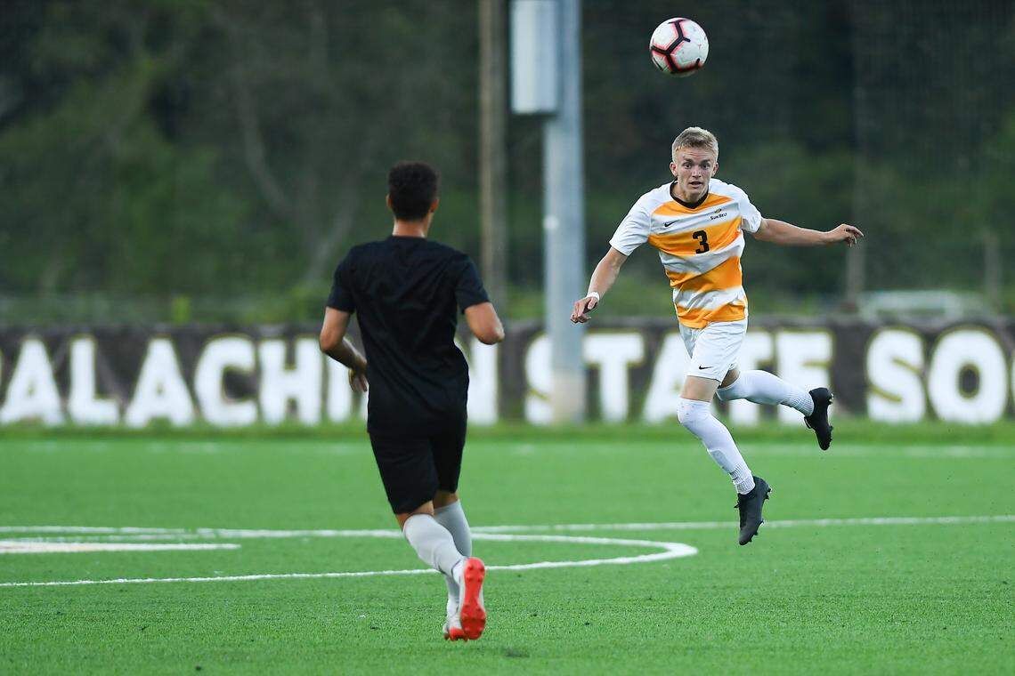 Appalachian State’s Reed Hunnicutt (3) heads the ball in a 2019 game. Hunnicutt, from Charlotte, will stay in school at App State and finish his degree in 2020 despite his soccer team being disbanded.