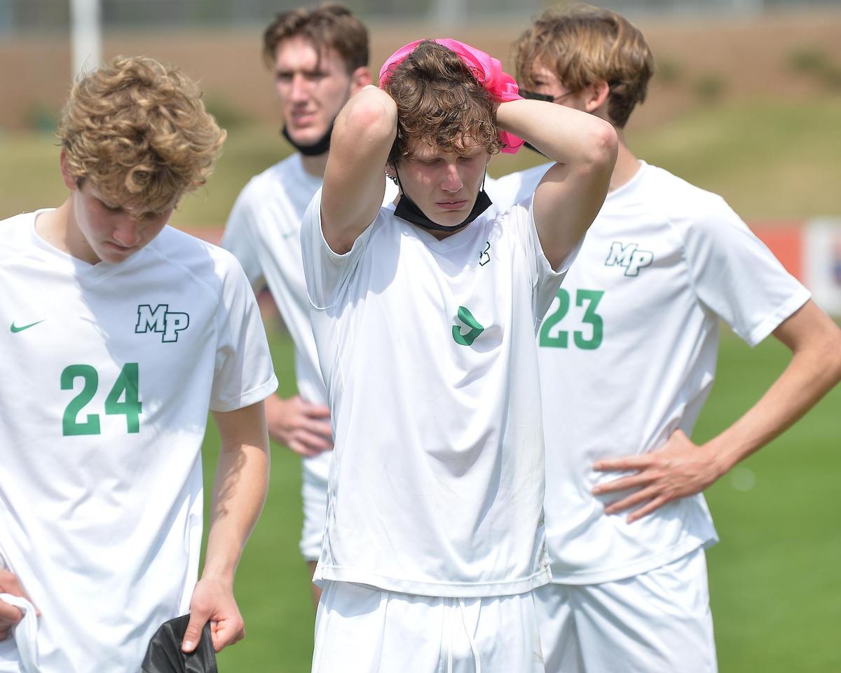 Myers Park’s Case Kabrich (9) reacts with James Anderson and (24) and Michael Guarda (23) after their team’s loss to Cardinal Gibbons in the NCHSAA 4A Boys Soccer Finals. The Cardinal Gibbons Crusaders and the Myers Park Mustangs met in the NCHSAA 4A Boys Soccer Championship game in Cary N.C. on March 27, 2020