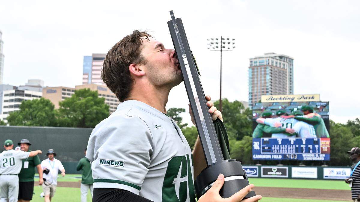 Tournament MVP Cam Fisher celebrates after Charlotte defeated Dallas Baptist in the Conference USA championship. (Maria Lysaker/CUSA)