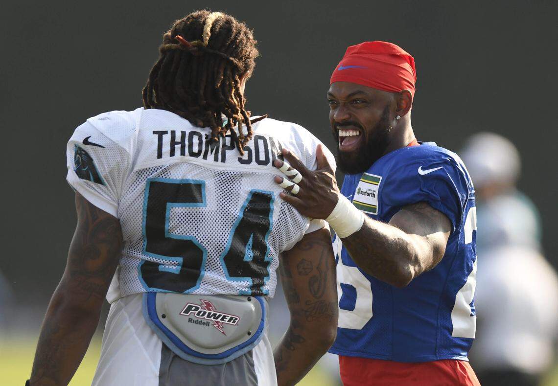 Buffalo Bills defensive back Captain Munnerlyn (26) jokes with Carolina Panthers outside linebacker Shaq Thompson (54) prior to the start of their joint practice at Wofford College in Spartanburg, SC on Tuesday, August 13, 2019.