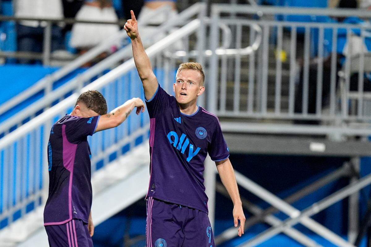 Charlotte FC forward Karol Swiderski (9) reacts to his goal against CF Montreal during the first half at Bank of America Stadium. Charlotte FC won, 2-0.