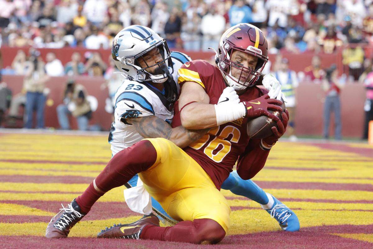 Oct 20, 2024; Landover, Maryland, USA; Washington Commanders tight end Zach Ertz (86) catches a touchdown pass as Carolina Panthers cornerback Dane Jackson (23) defends during the second quarter at Northwest Stadium. Mandatory Credit: Amber Searls-Imagn Images