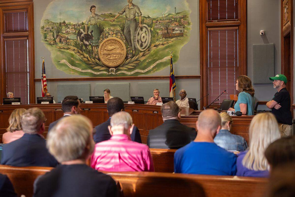 Locals speak out against the data center during a hearing by the Statesville Planning Board on a rezoning request for the proposed Stamey Farms data center in Statesville, N.C., on Tuesday, August 26, 2025.
