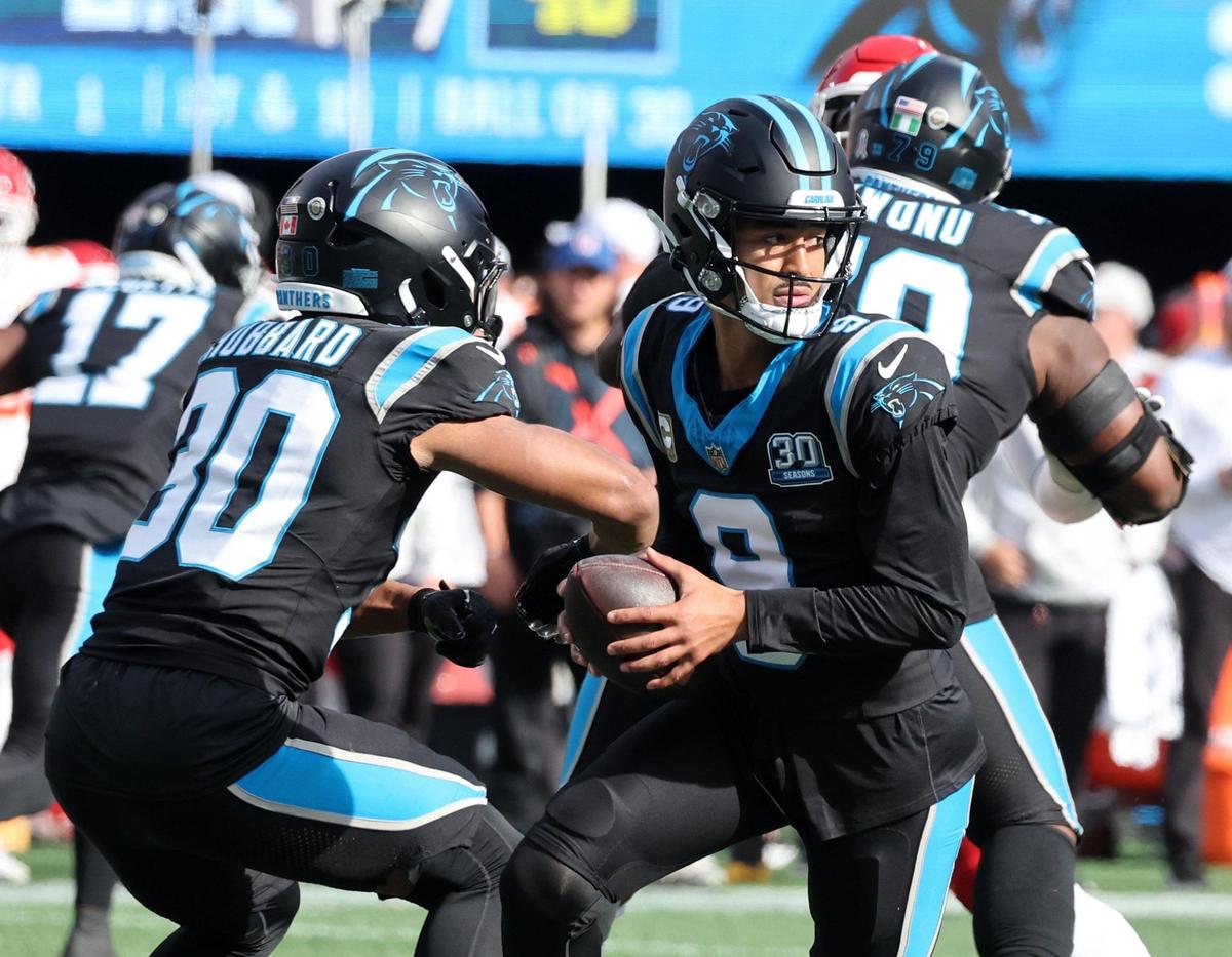 Panthers quarterback Bryce Young passes the ball to Chuba Hubbard Sunday, Nov. 24, 2024 in Charlotte N.C. as the Panthers hosted the Chiefs at Bank of America Stadium.