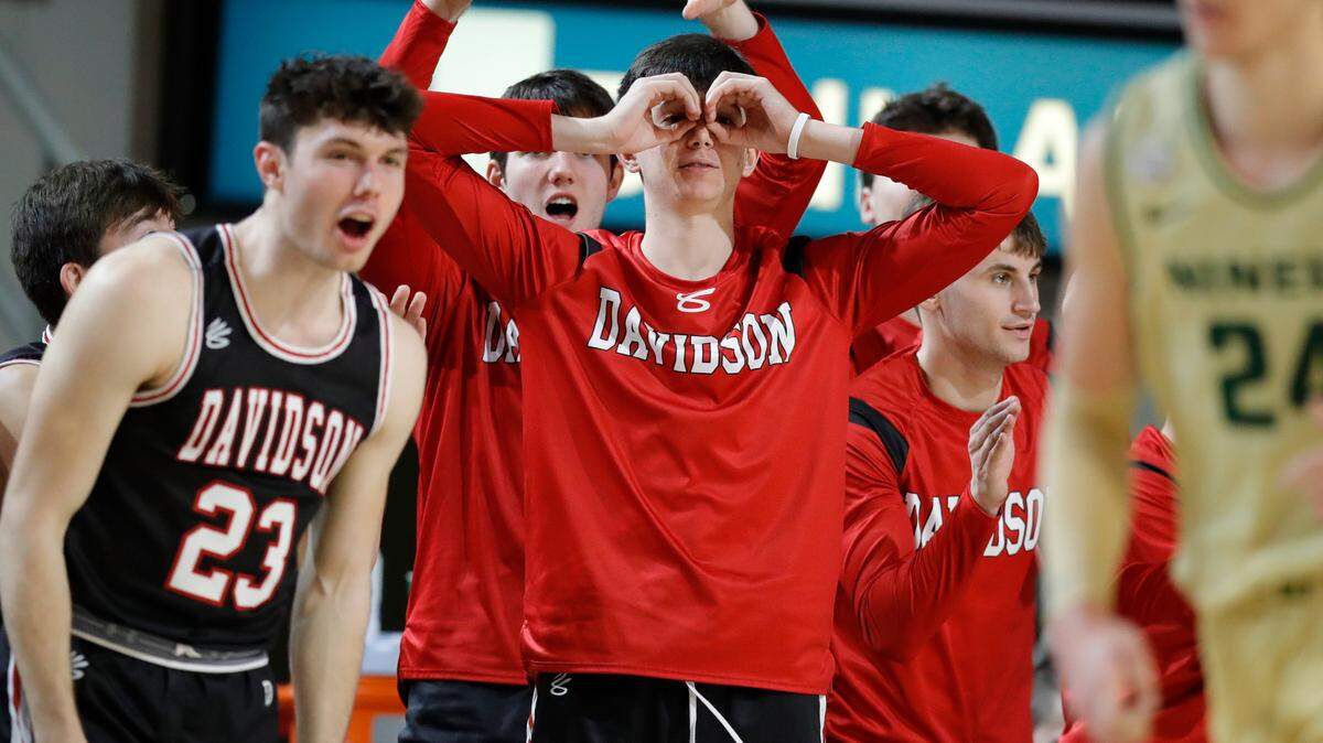 The Davidson Wildcats celebrate from the bench during a game against the Charlotte 49ers at Belk Arena in Davidson, N.C., Tuesday, Nov. 29. The Wildcats returned to the win column on Wedesday with a 72-64 win over Western Carolina.