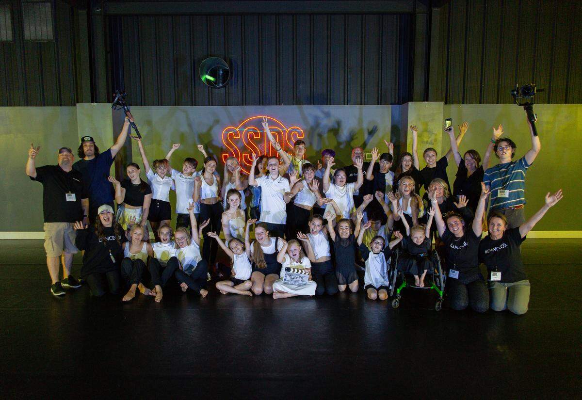 The crew and cast for “A Chance to DanceOn” pose for a group photo.