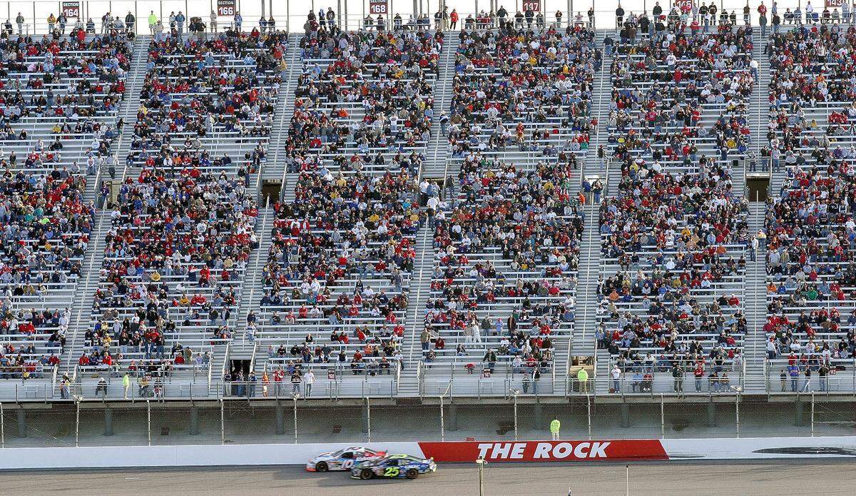 This Feb. 22, 2004 file photo, shows a sparse crowd during the Subway 400 NASCAR Nextel Cup race at North Carolina Speedway near Rockingham, N.C. NASCAR made its official return to Rockingham on Sunday, April 15, 2012, when the Trucks Series races around the beloved mile-long flat oval. It will be the first NASCAR-sanctioned event since 2004, when a long-term realignment plan led NASCAR to abandon its grass-roots tracks in favor of building up bigger markets such as California, Chicago and Kansas City.