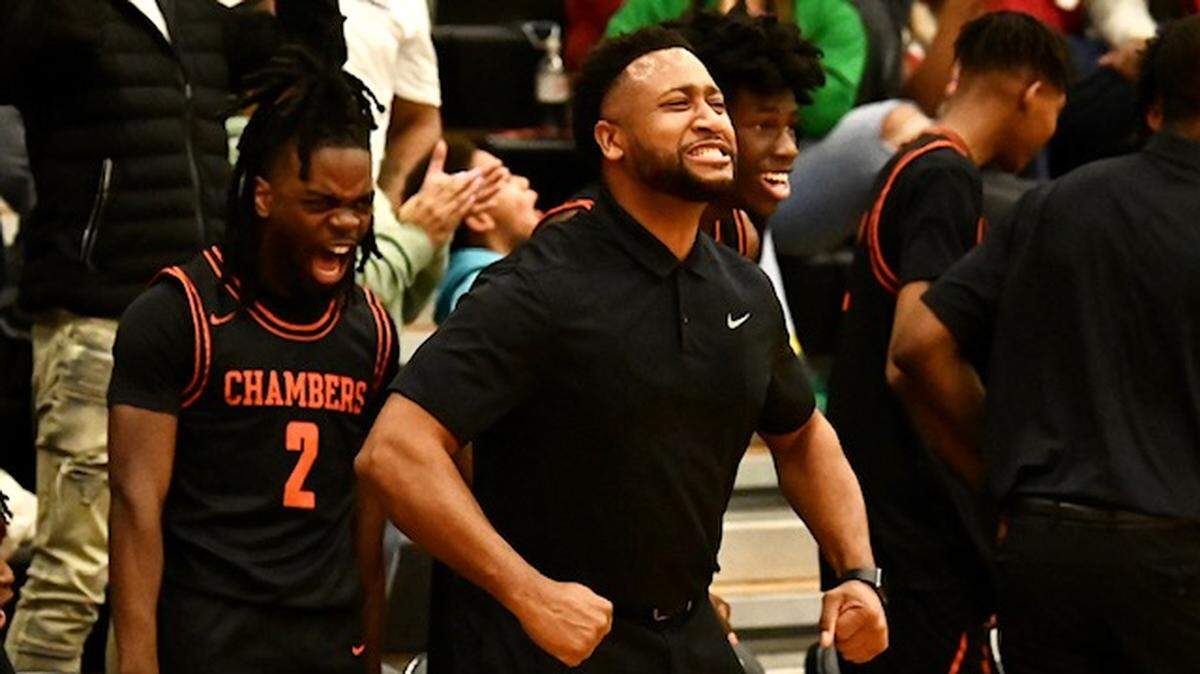 Chambers Cougars head coach Brian Frasier celebrates his team’s play against the Myers Park Mustangs on Tuesday, November 29, 2022 at Myers Park High. Chambers defeated Myers Park 71-60. Jeff Siner/The Charlotte Observer