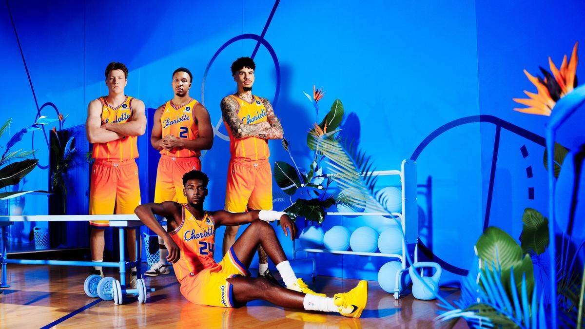 Kon Knueppel, Grant Willliams, Brandon Miller and LaMelo Ball model the Charlotte Hornets’ 2025-26 City Edition remix uniforms.