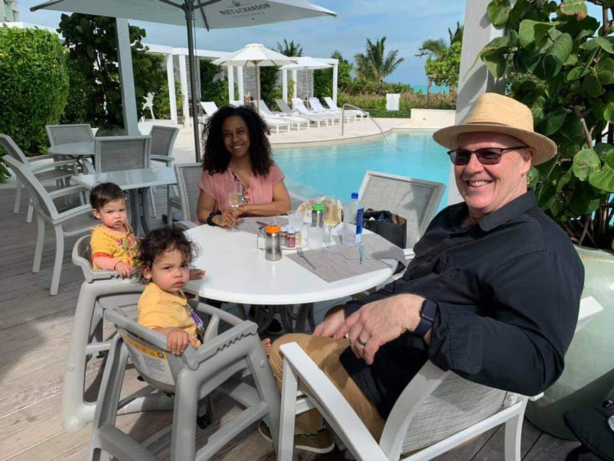 Joseph Franklyn McElroy with his wife Simone and their twin toddlers.