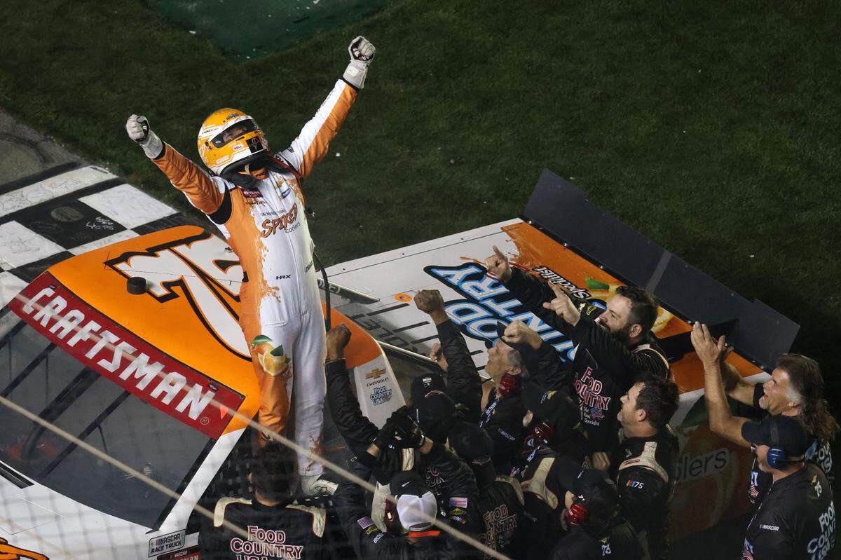 NASCAR Truck Series driver Parker Kligerman (75) reacts after winning the Fresh From Florida 250 at Daytona International Speedway.