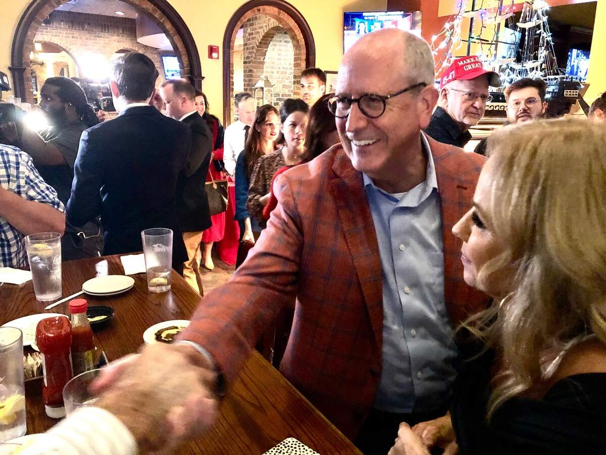 Congressman Dan Bishop, right shakes hands with supporters at Spiro’s Hilltop Fish Fare and Steakhouse in Monroe, NC on Thursday, November 5, 2024. Bishop was attending an election watch party for his run to become NC Attorney General.