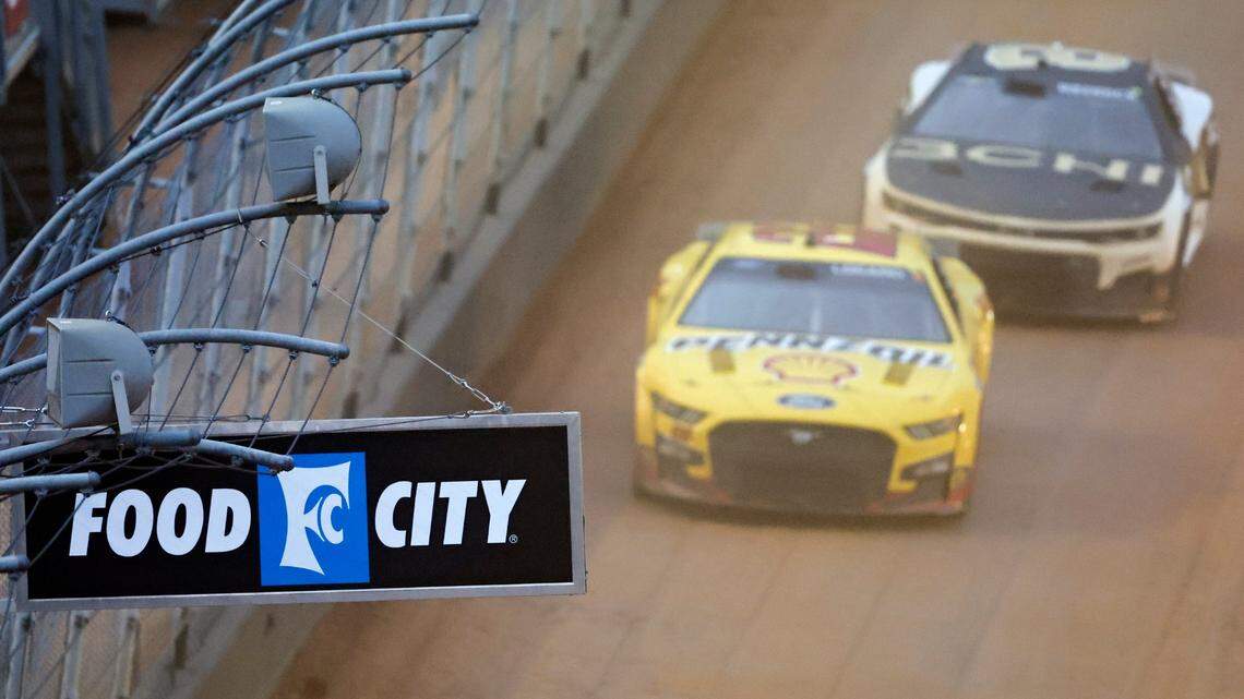 Driver Joey Logano (22) leads driver Tyler Reddick (8) during a NASCAR Cup Series auto race, Sunday, April 17, 2022, in Bristol, Tenn. (AP Photo/Wade Payne)