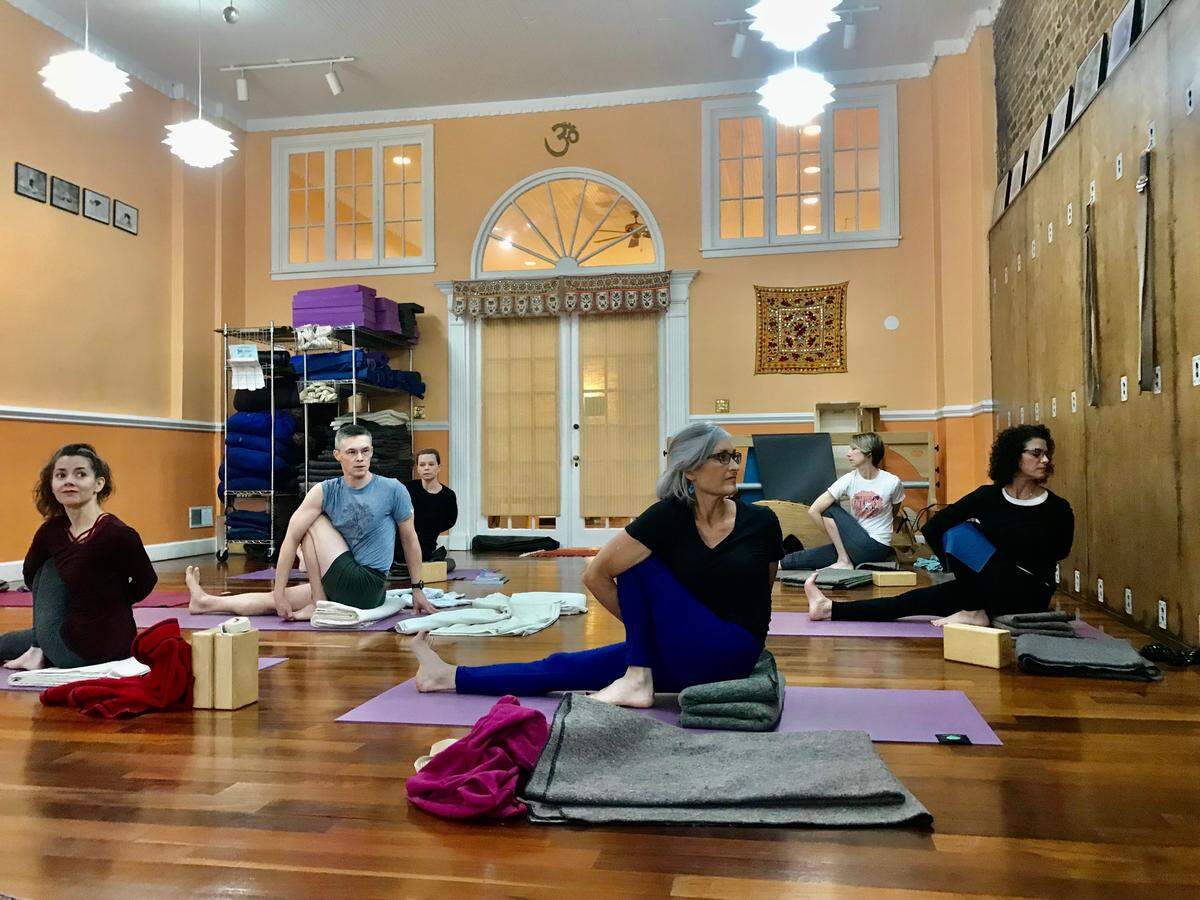 Iyengar Yoga focuses on the structural alignment of the body, and uses props including blocks, blankets and belts as part of the practice.