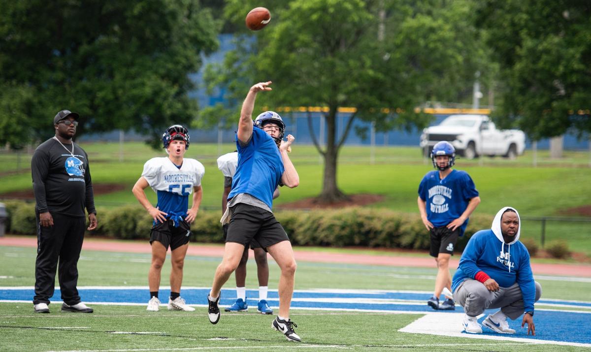 Mooresville High players practice drills at Coach Joe Popp Stadium on July 25, 2024.
