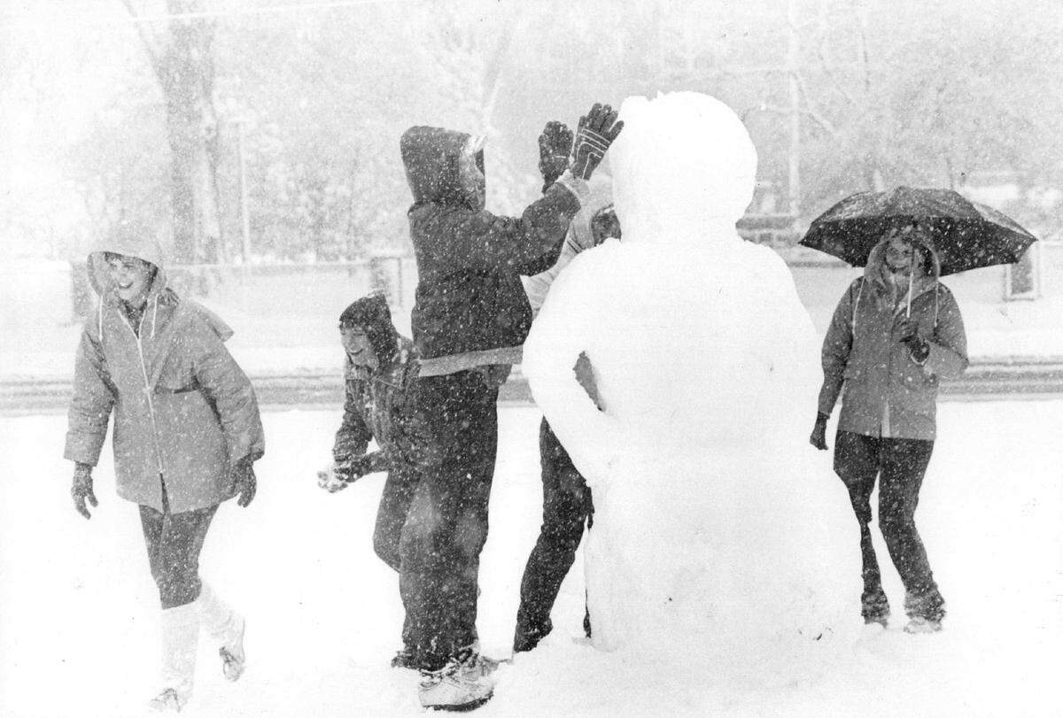 Winthrop College students make a snowman following a Spring snowfall in the Charlotte region in March 1983.