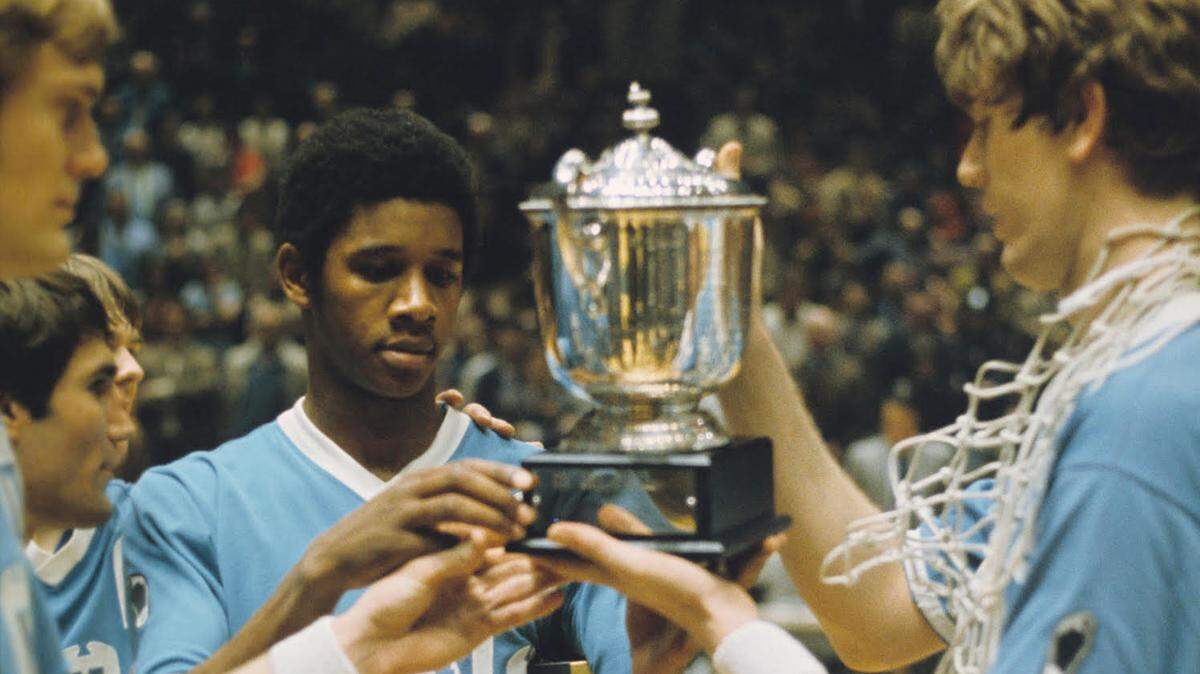 Bill Chamberlain (center) holds the 1971 NIT trophy, which UNC won after defeating Duke in an NIT semifinal. That game represents the only time UNC and Duke ever faced each other in a postseason tournament other than the ACC tourney -- until the 2022 Final Four.