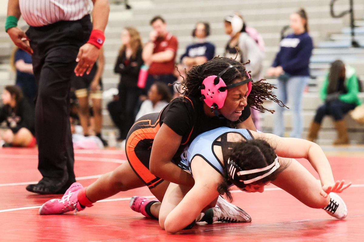 Ballantyne Ridge Wolves Sofia Salas, bottom, wrestles Rocky River Ravens Lyric Bingham at Ballantyne Ridge High School in Charlotte, N.C., on Thursday, January 23, 2025.