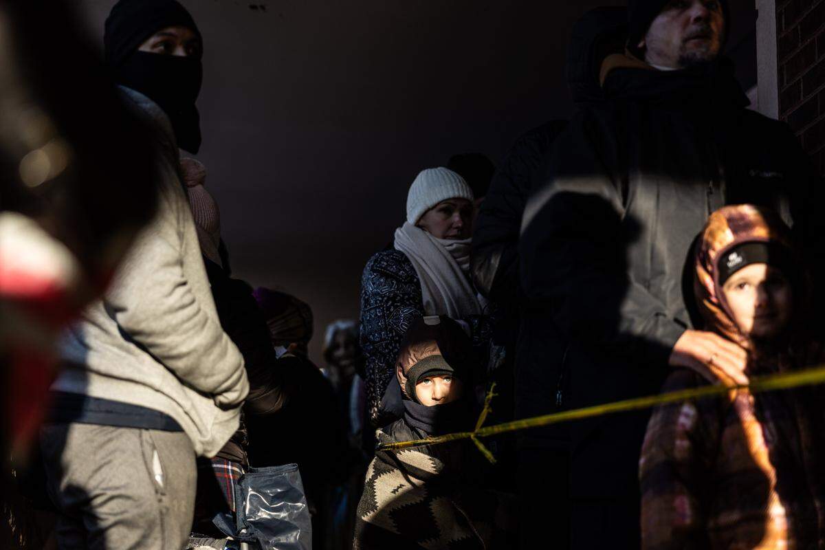 People wait outside the Department Homeland Security office in Charlotte on Wednesday, January 21, 2026.