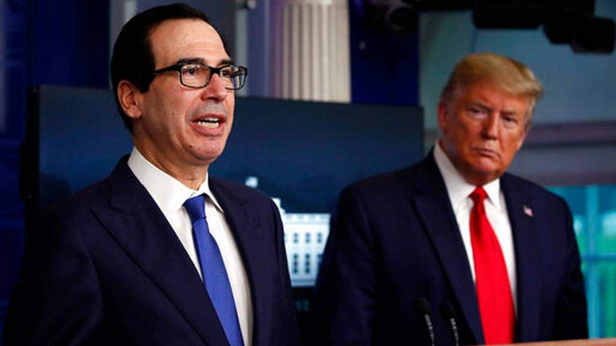 President Donald Trump listened April 14 as Treasury Secretary Steven Mnuchin talked about the Paycheck Protection Program, which quickly ran out of money. Monday, the Trump administration and Congress were trying to reach an agreement on a $450 billion boost to the small-business loan program.