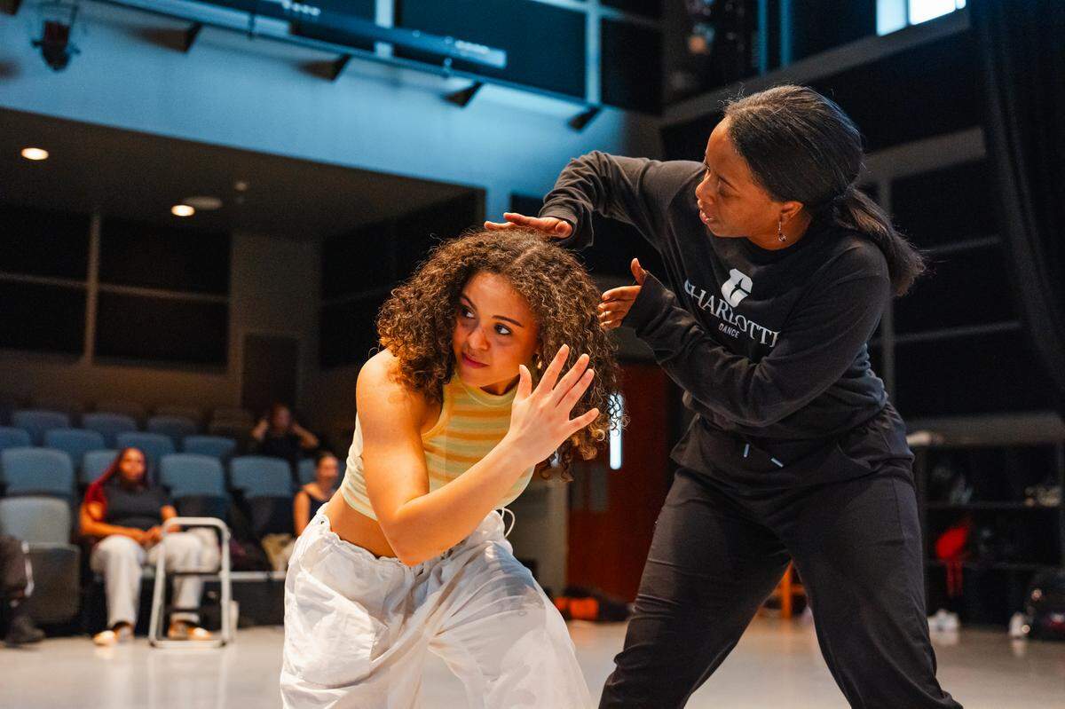 UNC Charlotte’s Ashley Tate working with a student at the university. Tate is organizing hip-hop symposium for scholars, artists and the community at the university Oct. 17-19.
