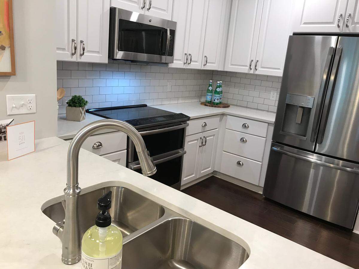 A model kitchen at 511 Queens includes a double-oven that is also wifi-enabled.