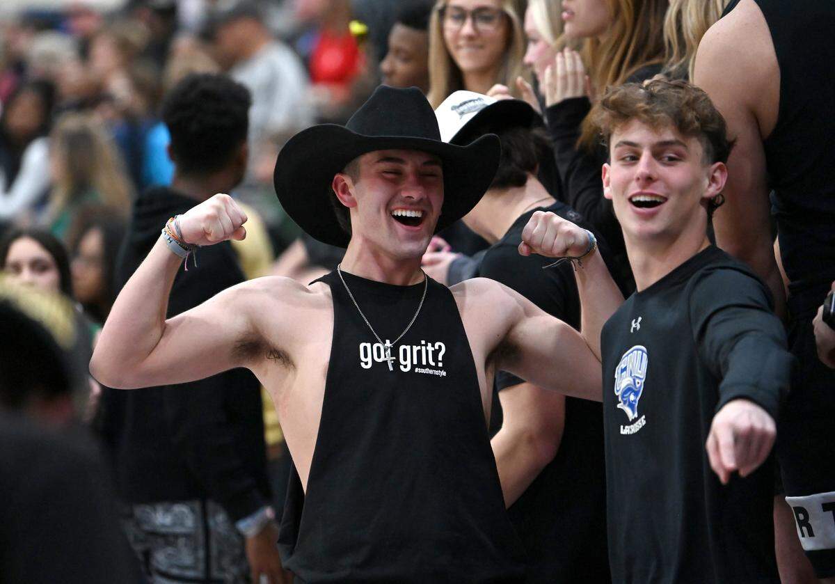 A Weddington High fan flexes his muscles as the team battles Mooresville during the second round of NCHSAA action on Thursday, February 24, 2022. Weddington is top a top 25 nationally ranked team.