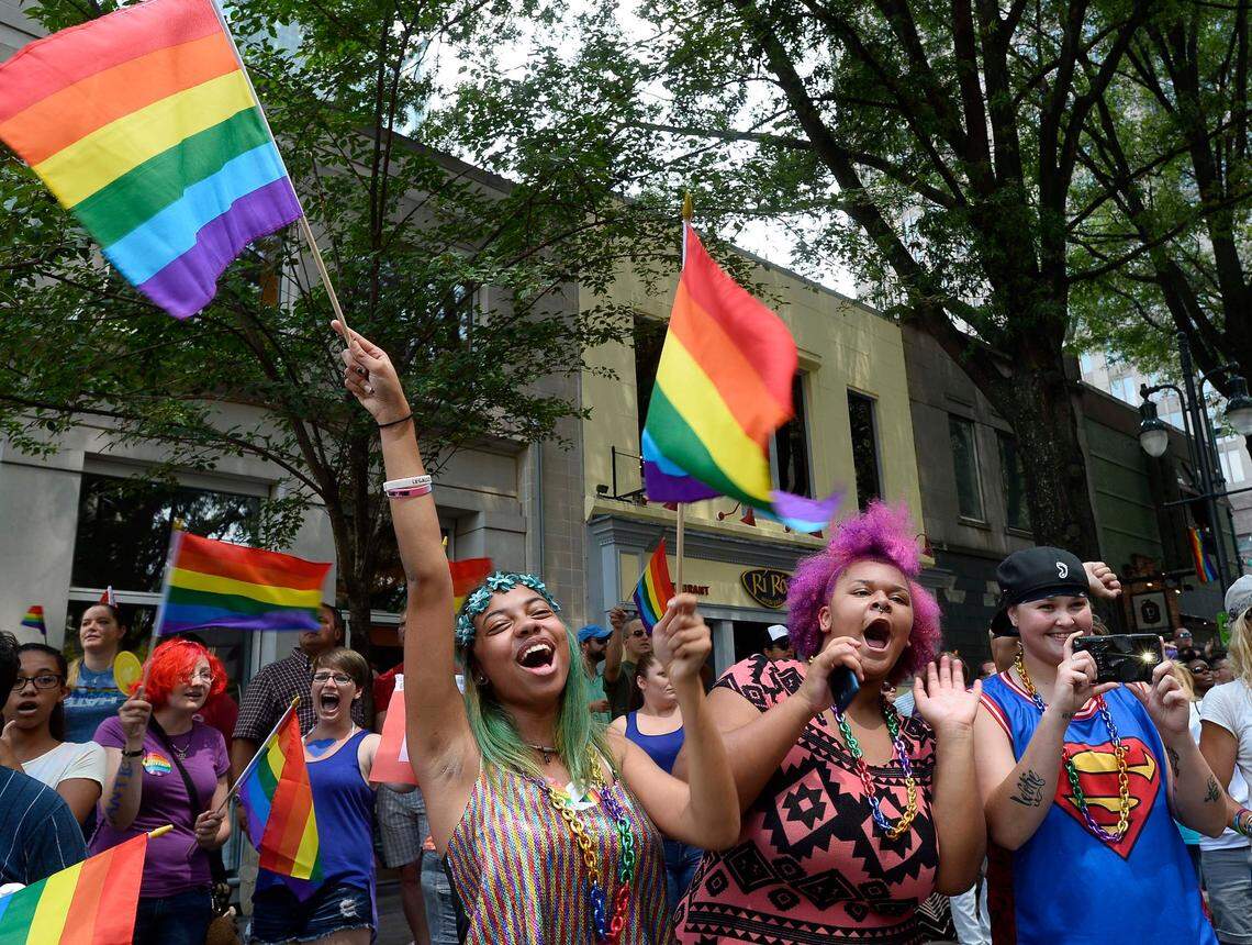 Charlotte Pride parade watchers line Tryon Street during the 2015 celebration. The festivities return to uptown this weekend for the first time since 2019.