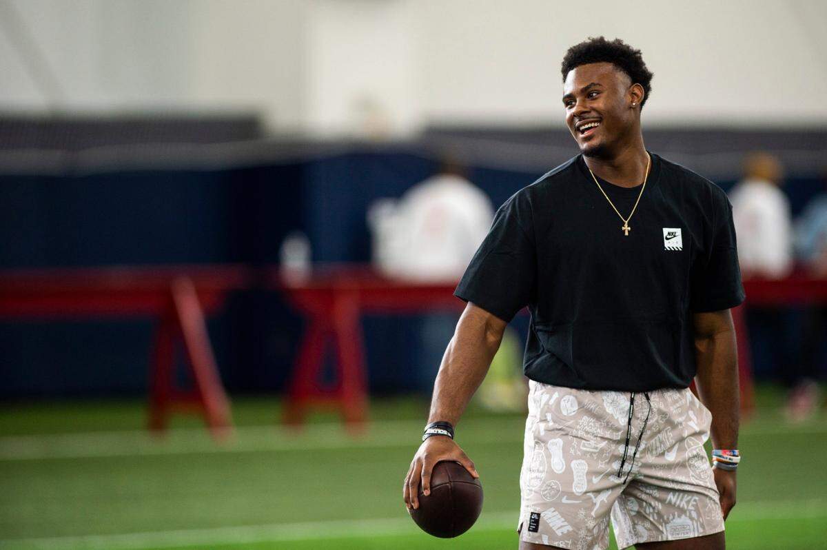 Liberty quarterback Malik Willis practices before running through passing drills during the school’s pro football day for NFL scouts and coaches, Tuesday, March 22, 2022, in Lynchburg, Va. (AP Photo/Kendall Warner)