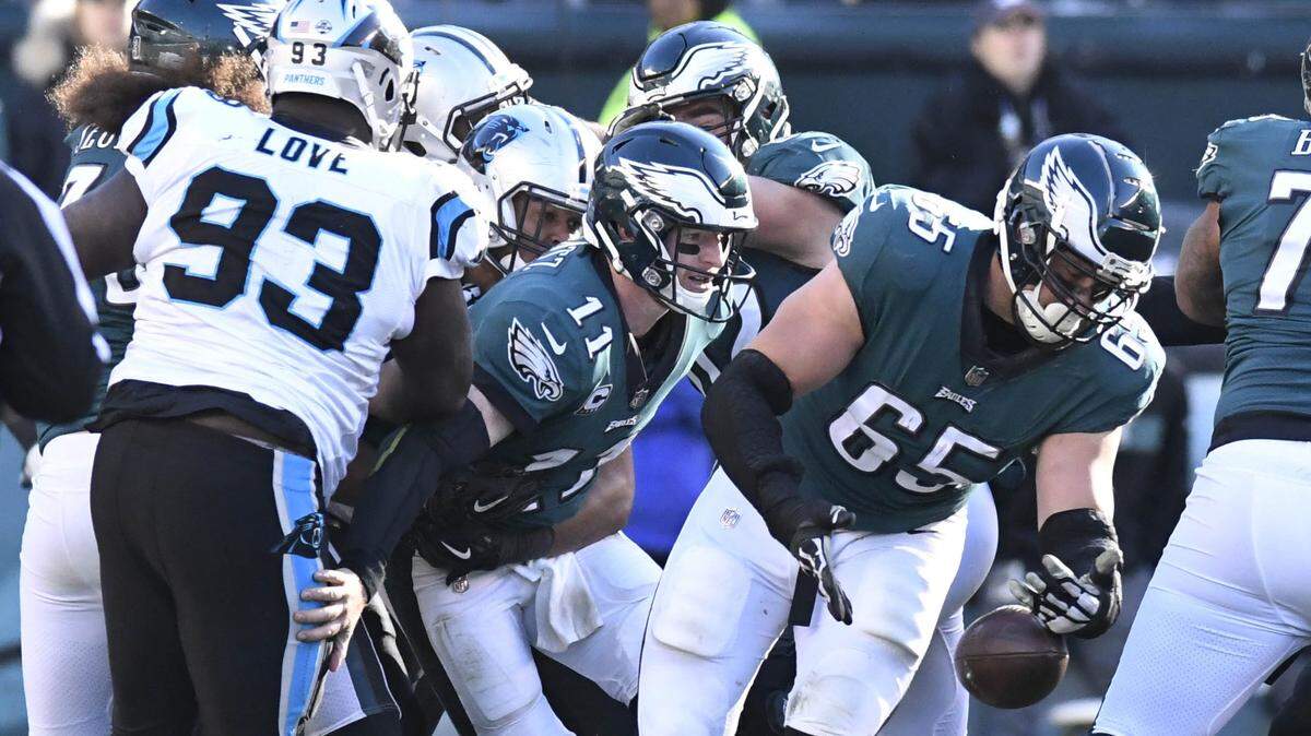 Despite playing poorly for three quarters, the Carolina Panthers’ defense forced Philadelphia Eagles quarterback Carson Wentz (11) to fumble the ball on the last play of Sunday’s game to seal a 21-17 comeback victory.