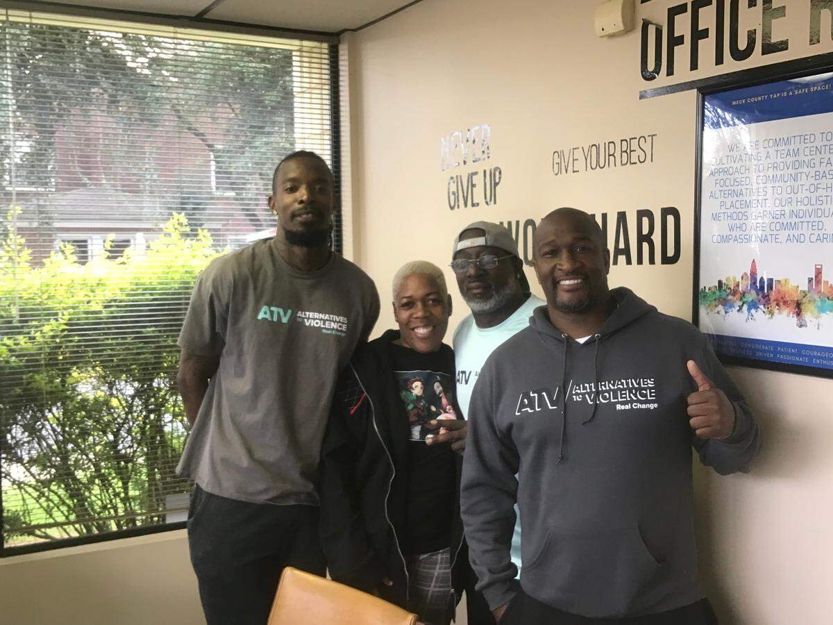 From left: Alternatives to Violence members Dimitros Jordan, Leondra Garrett, Donnell Gardner and Larry Mims. Youth Advocate Programs, one of the two nonprofits running the Beatties Ford Road team, will also oversee a new team coming in the near future to the West Boulevard area. Taken March 5, 2023.