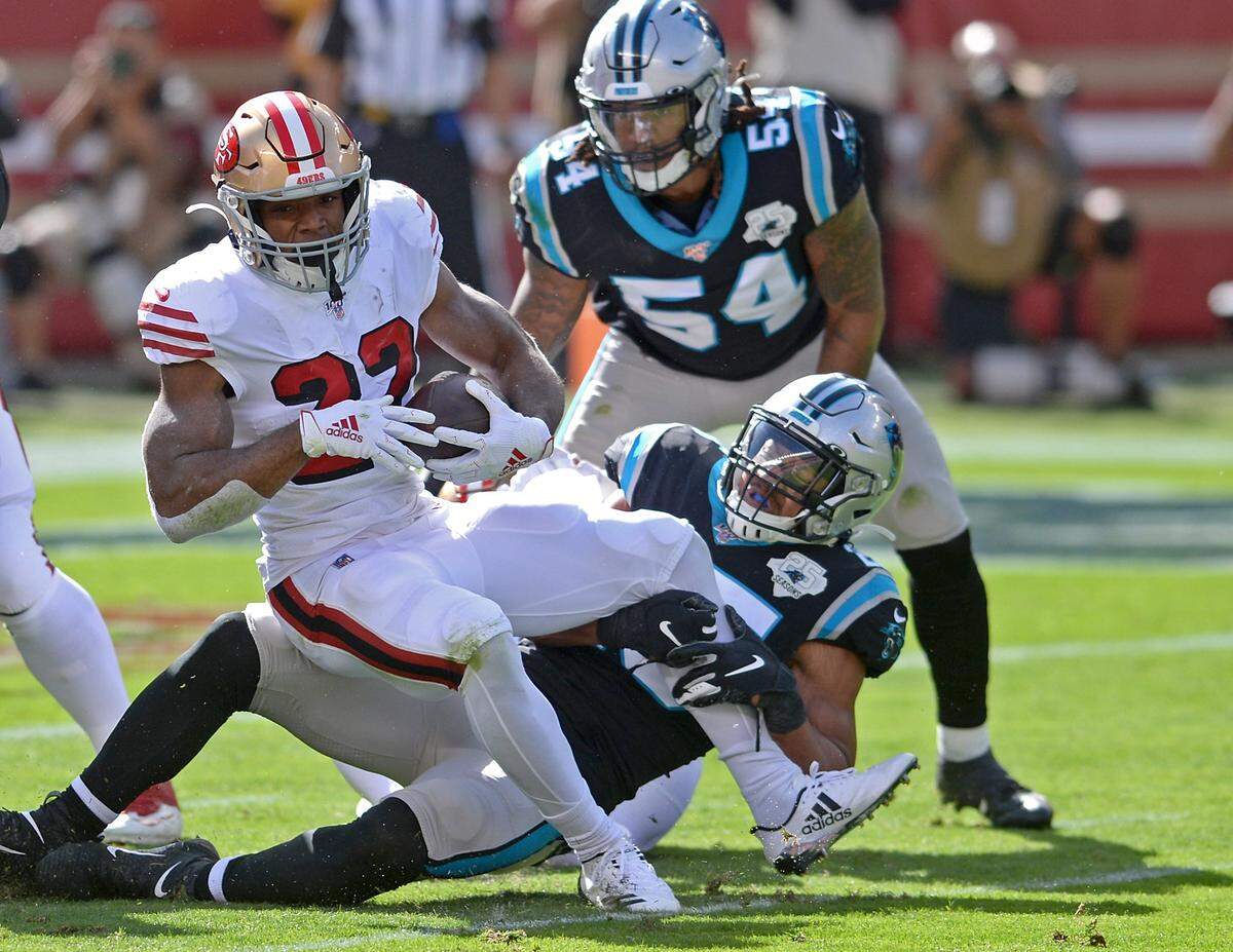 Carolina Panthers safety Eric Reid, right, fights to make the tackle of San Francisco 49ers running back Matt Breida, left, during first quarter action at Levi’s Stadium in Santa Clara, CA on Sunday, October 27, 2019.The 49ers defeated the Panthers 51-13.