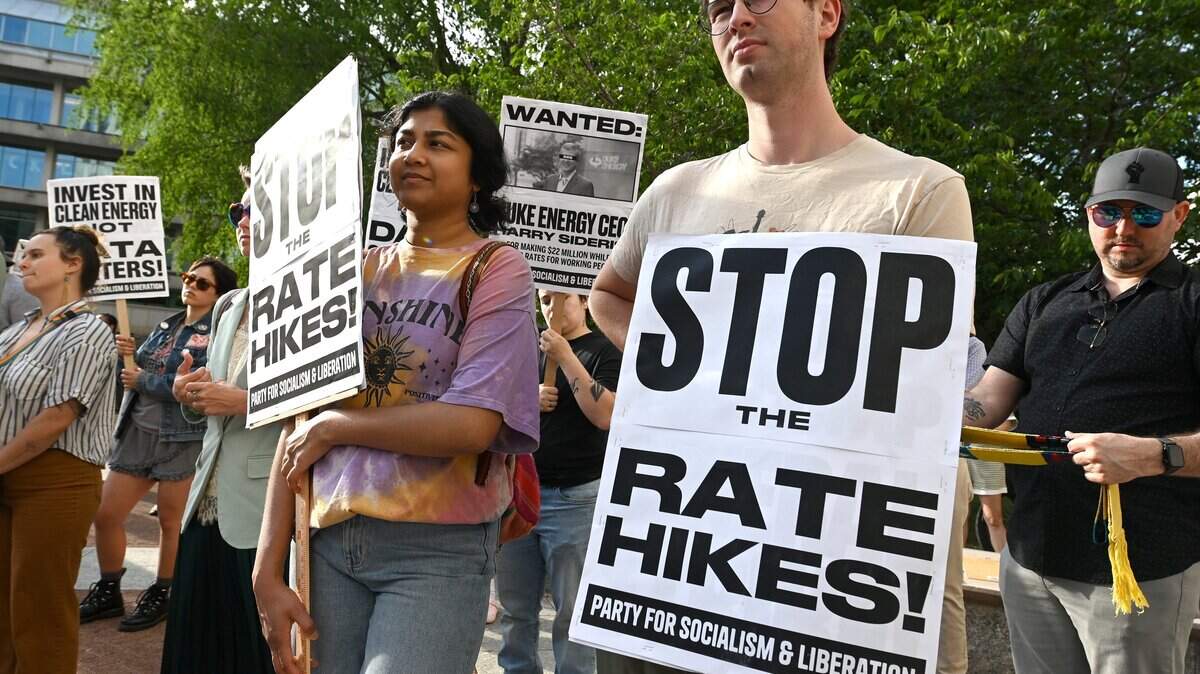 Concerned citizens gather for a rally outside the Mecklenburg County Courthouse in Charlotte, NC on Wednesday, April 29, 2026. The rally is in response to Duke Energy's request to increase residential customer's bills in North Carolina by about 18 percent. The rally preceded a North Carolina Utilities Commission hearing where commissioners listened to public testimony about the possible increase.