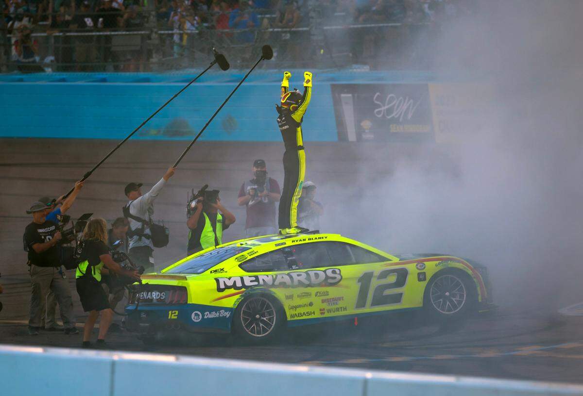 Nov 5, 2023; Avondale, Arizona, USA; NASCAR Cup Series driver Ryan Blaney celebrates after winning the 2023 NASCAR Cup Series championship at Phoenix Raceway.