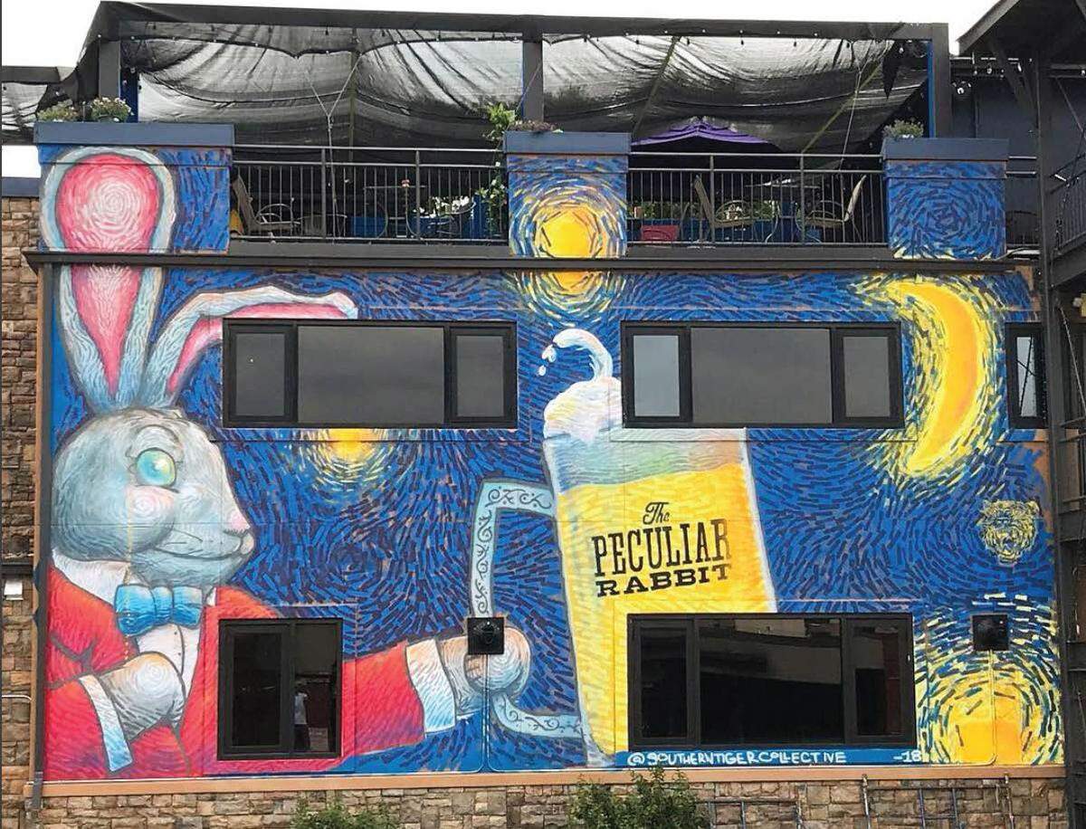 This mural, painted in June 2018, can be found at The Peculiar Rabbit on Pecan Avenue in Charlotte's Plaza-Midwood neighborhood. It was painted by Mike Wirth and Dustin Moatesk.