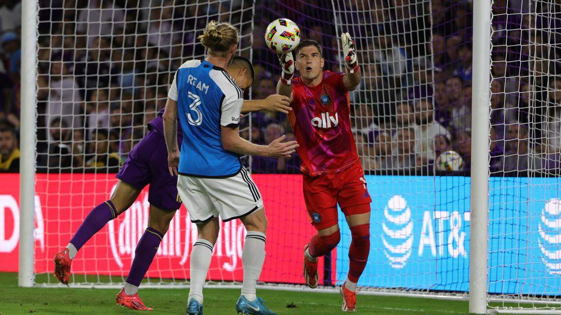 Charlotte FC goalkeeper Kristijan Kahlina (1) reaches for the ball in the first half against the Orlando City in a 2024 MLS Cup Playoffs Round One match at Inter&Co Stadium.