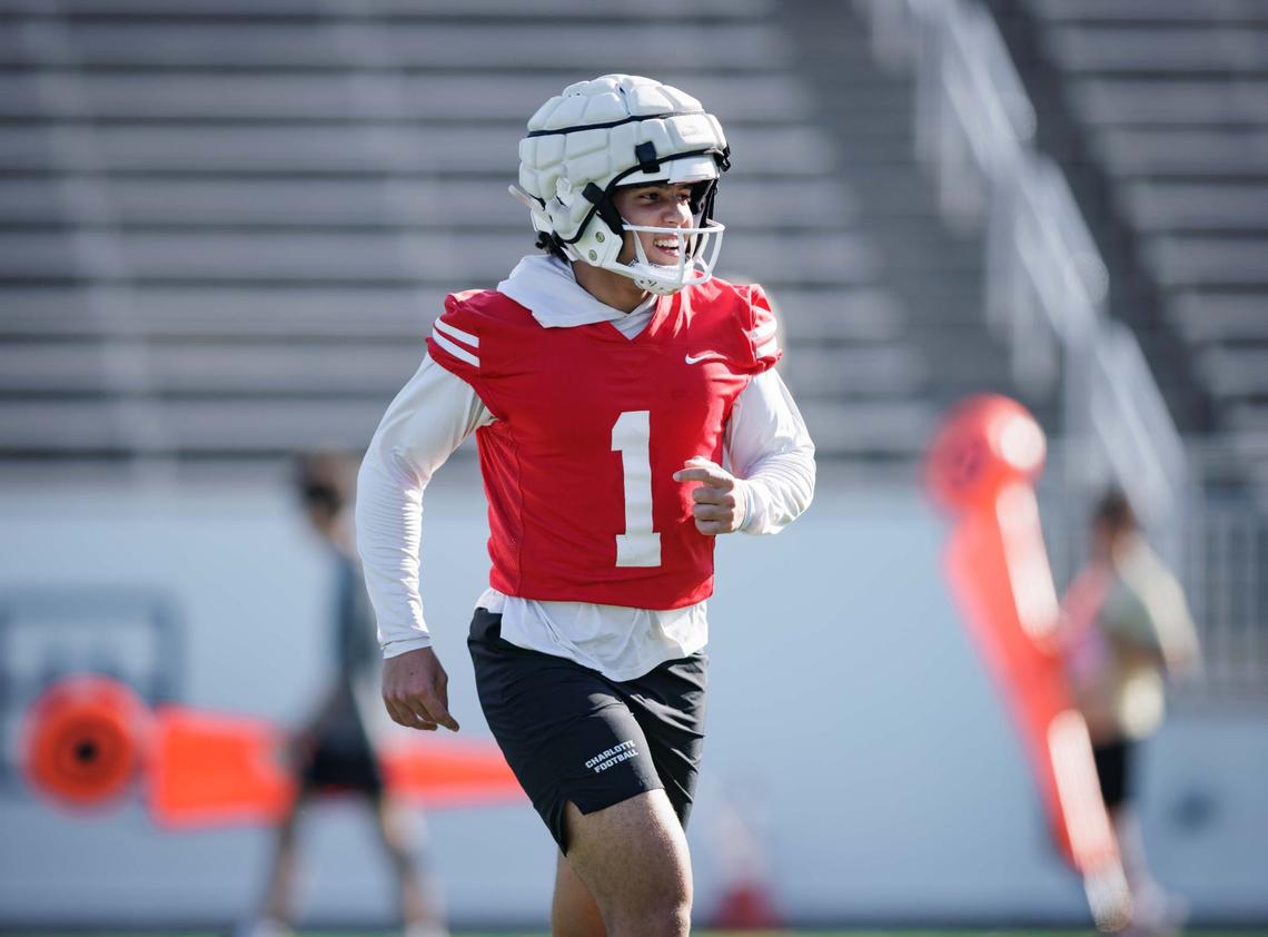 Charlotte 49ers’ starting quarterback Max Brown (1) runs through scrimmage drills during the final intrasquad game at Jerry Richardson Stadium Saturday August 24, 2024.