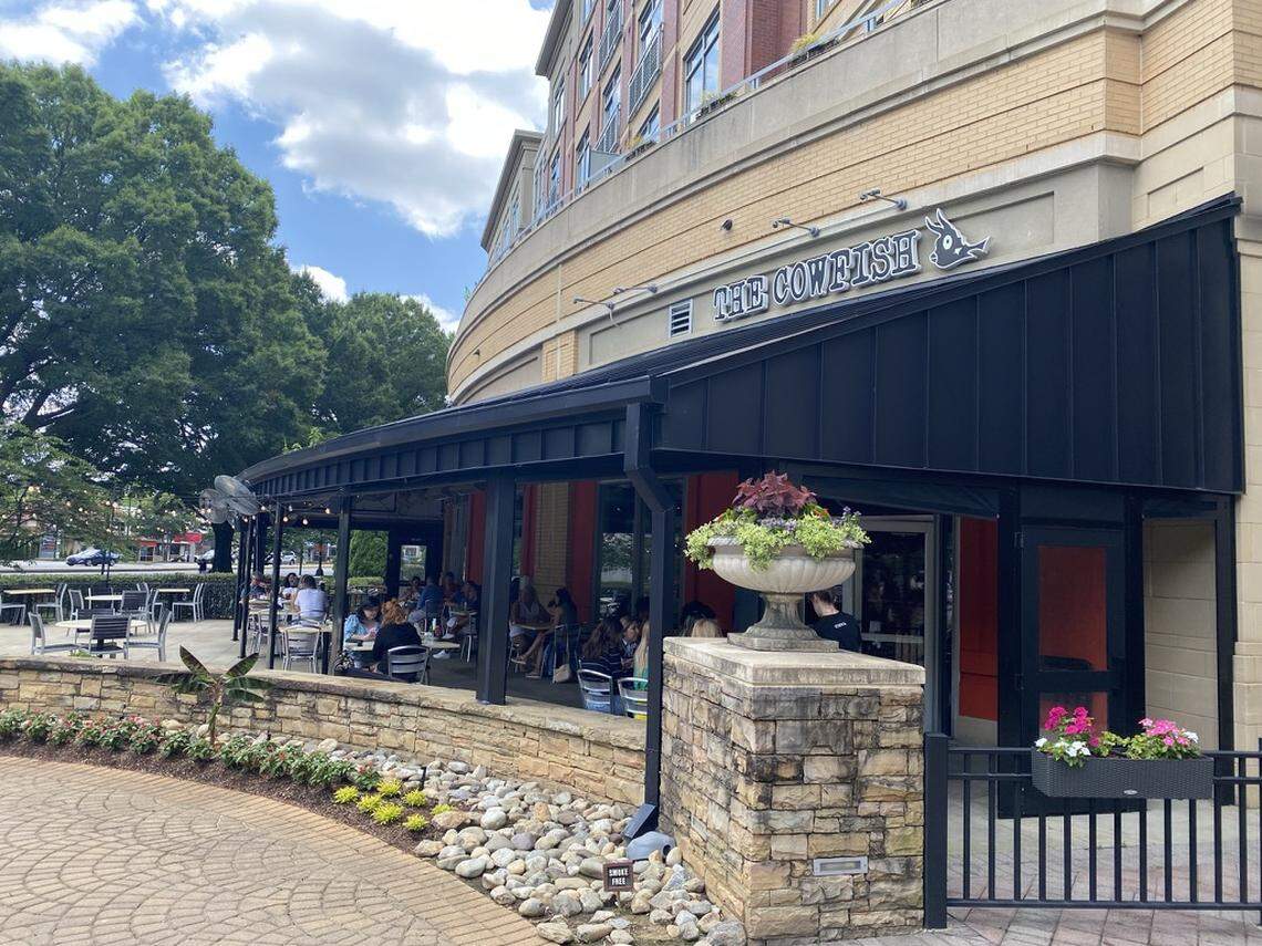 The Cowfish Sushi Burger Bar patio is shaded and has fans.