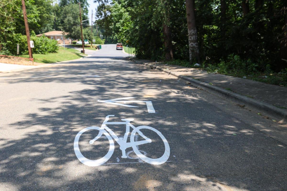 A bicycle painted on Jennings Street, in the Lincoln Heights neighborhood, indicates the future build of a bike lane.