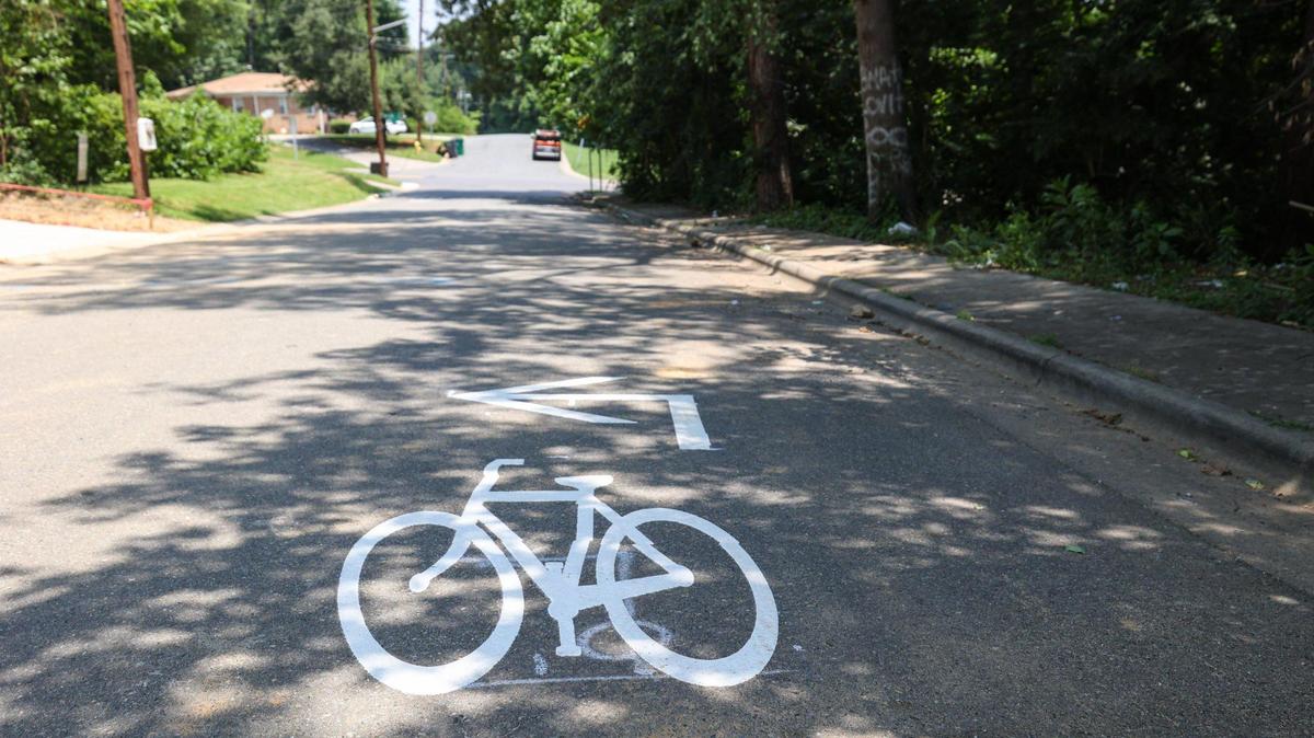 A bicycle painted on Jennings Street, in the Lincoln Heights neighborhood, indicates the future build of a bike lane.