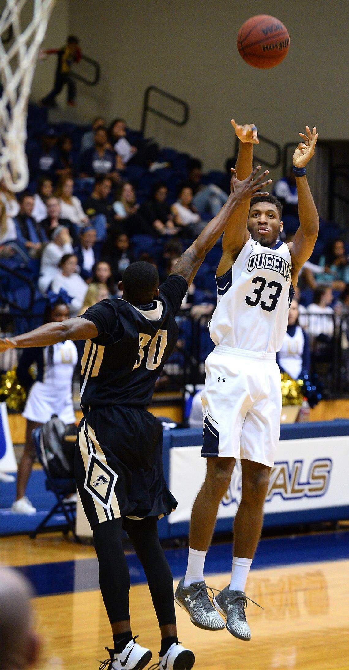 Queens University's Todd Withers, right, is a 6-8 guard-forward hoping for a shot at the NBA. He has done four NBA tryouts so far, including one with the Charlotte Hornets.