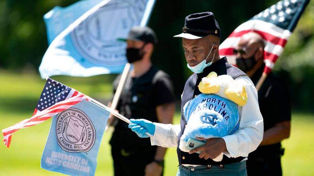 William Thorpe leads the Union Soldier Campaign in a protest at Bennett Place in Durham on Tuesday. The group called on the University of North Carolina to drop the Tar Heel name due to its connection to the Civil War and the Confederacy.