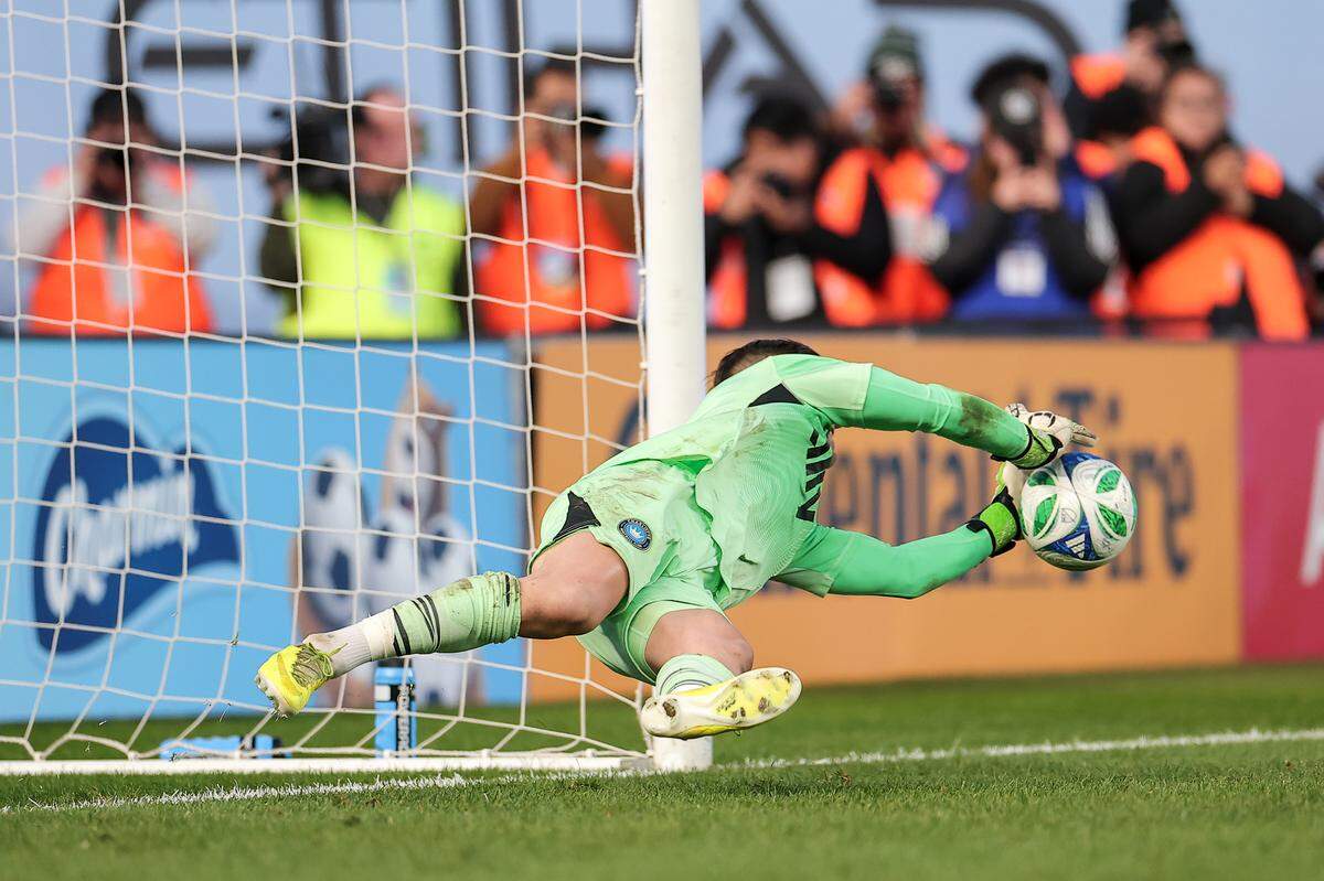 Charlotte FC’s Kristijan Kahlina makes a save to win the match in a penalty shootout against New York City FC in the MLS Cup playoffs on Saturday at Yankee Stadium.
