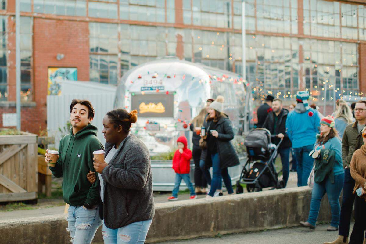 Jamestown, an Atlanta-based real estate investment firm, is the new property manager for Camp North End in Charlotte, shown during a holiday market event.