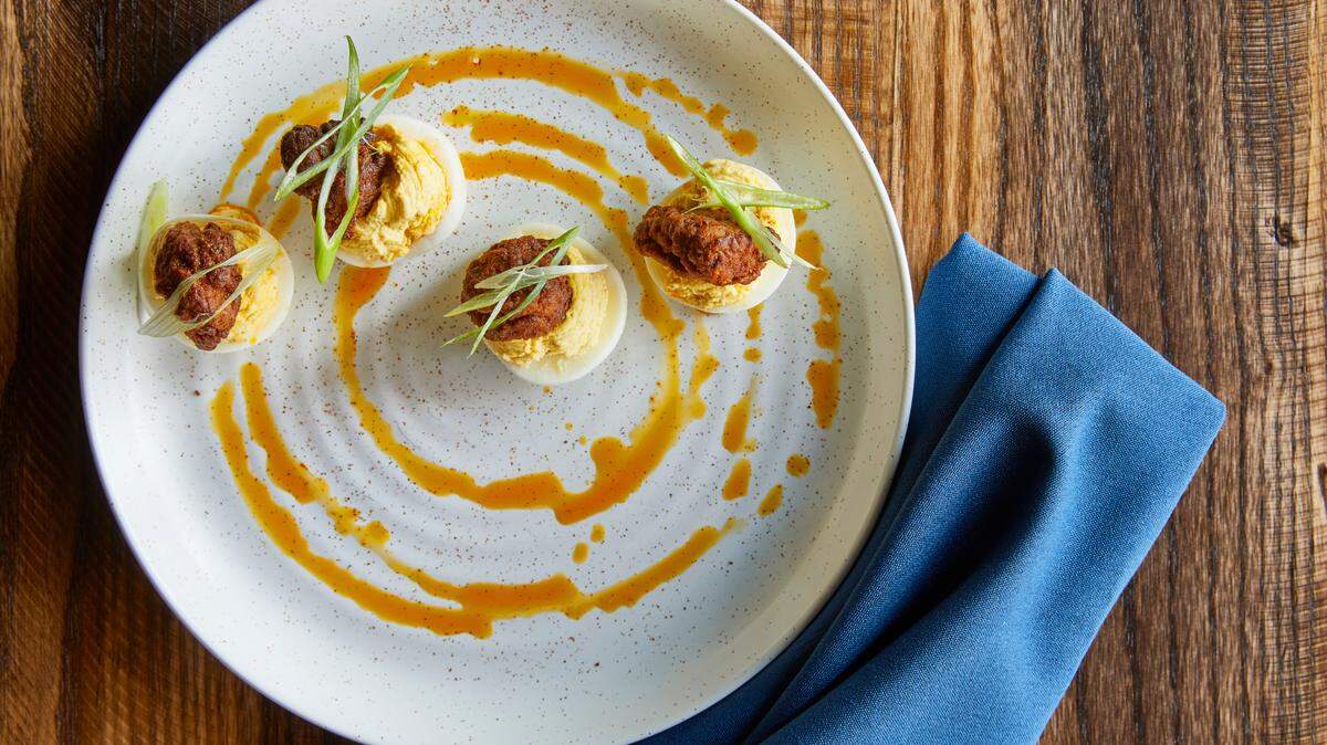 Golden Owl Tavern’s Deviled Eggs are topped with a nugget of Nashville hot chicken ($9).