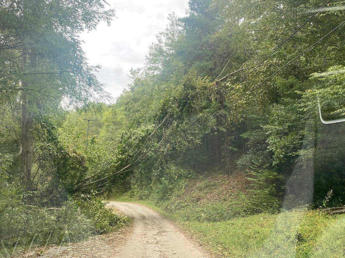 Uncleared damage remains in Leicester. While the area mostly escaped flooding, downed trees have hindered access and cut off power.