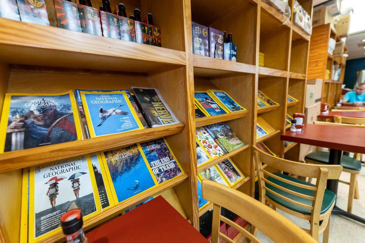 Rusty’s interior is lined with magazine racks filled with soda bottles and National Geographic magazines.